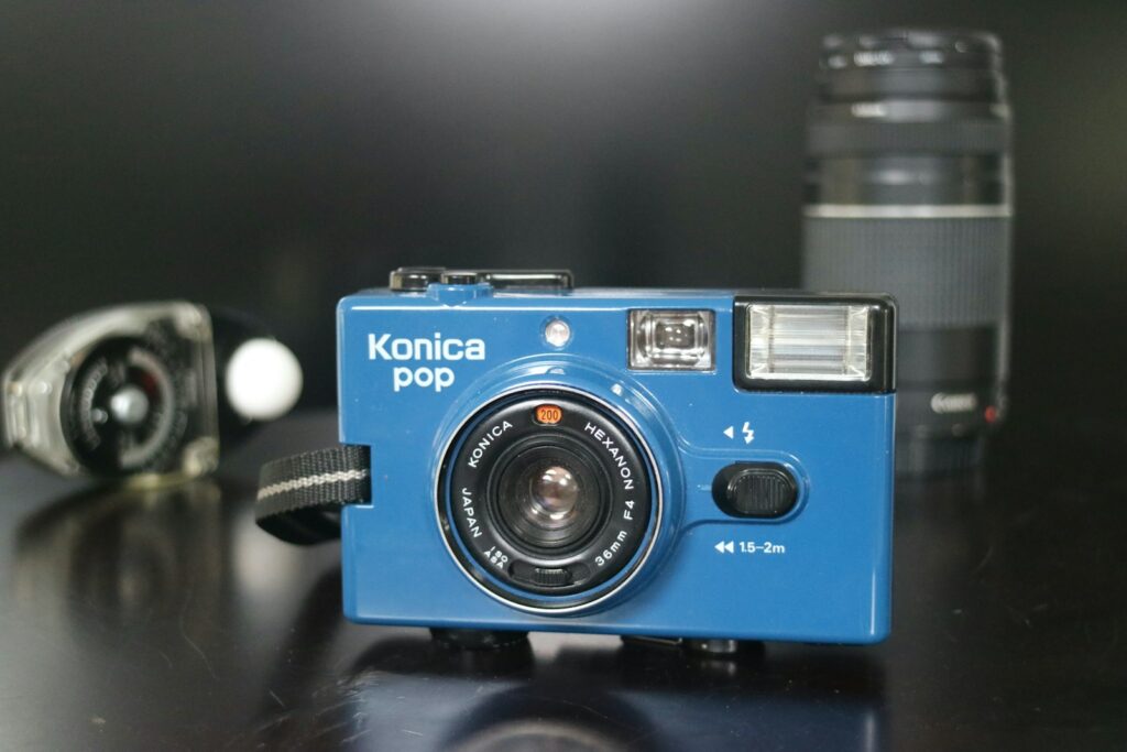 blue and silver nikon point and shoot camera