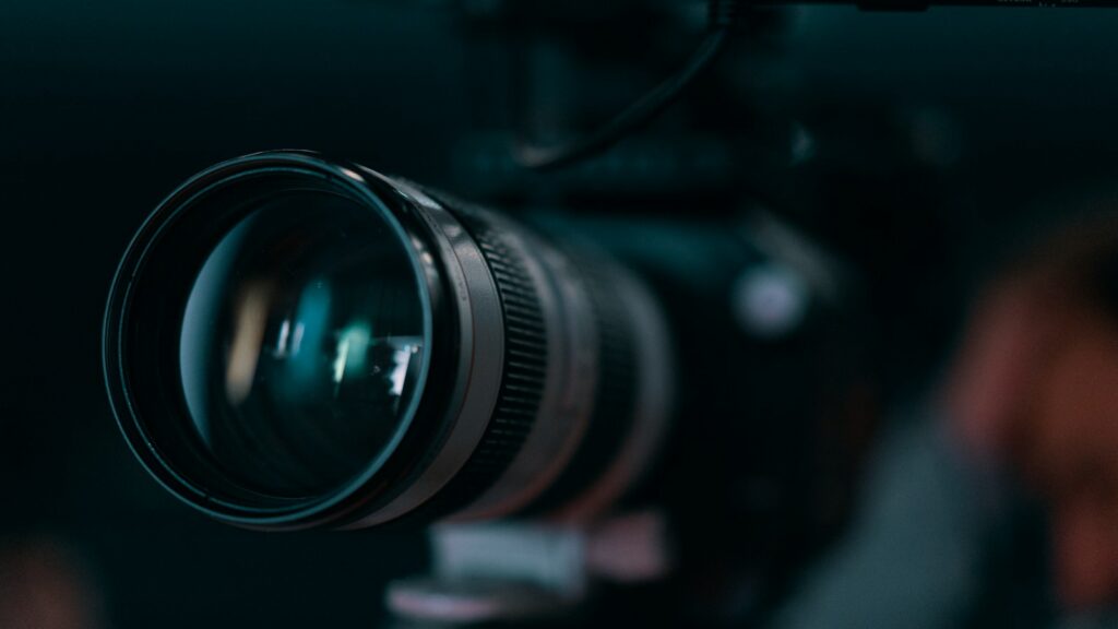 close-up of a camera's lens barrel and focus ring in sharp detail"
