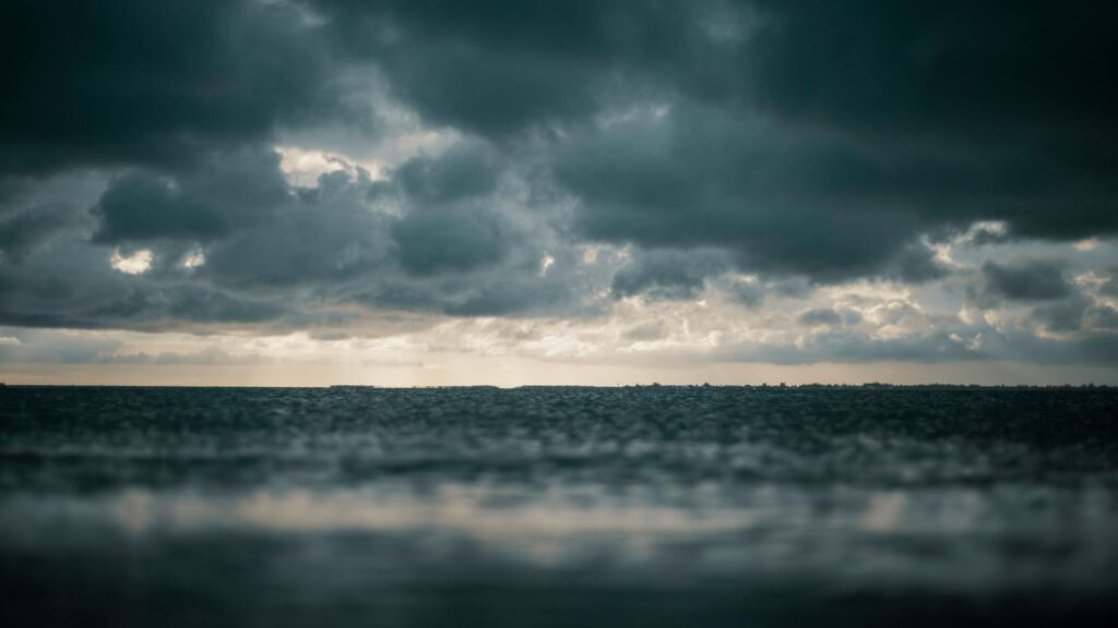 Ominous storm clouds rolling in over the open ocean