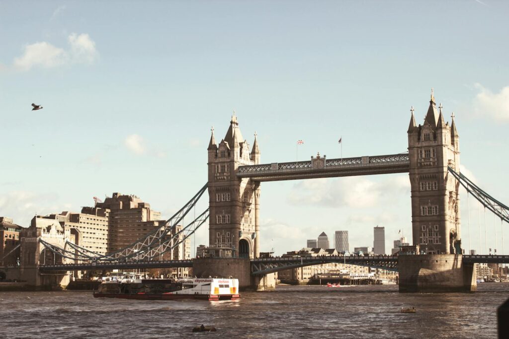 Iconic view of Tower Bridge spanning the River Thames in London against a clear sky.