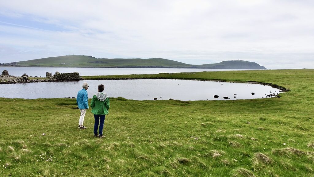 Pair of people scanning the skies for Arctic Terns at Scatness