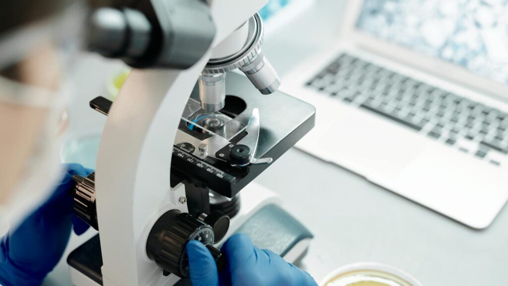 biologist in a lab coat analyzing specimen