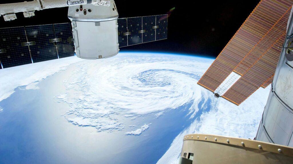 Aerial view of massive hurricane forming over Earth from outer space