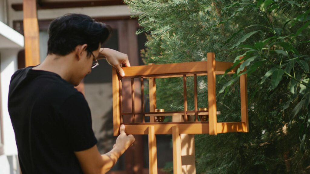 Man working on a DIY bird feeder