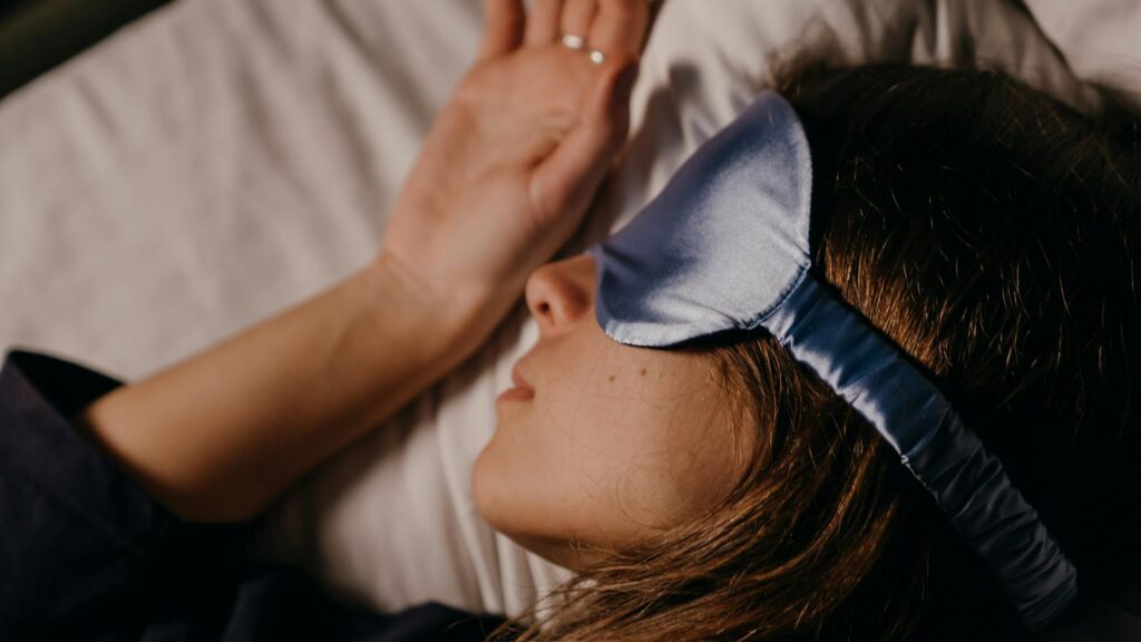 A woman peacefully sleeping in bed