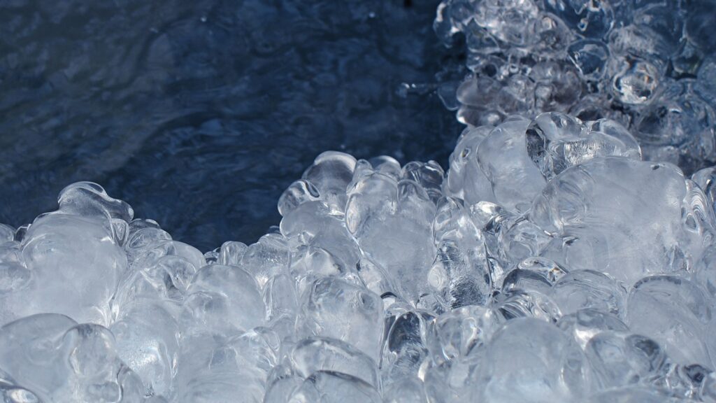 Pile of ice stacked above water