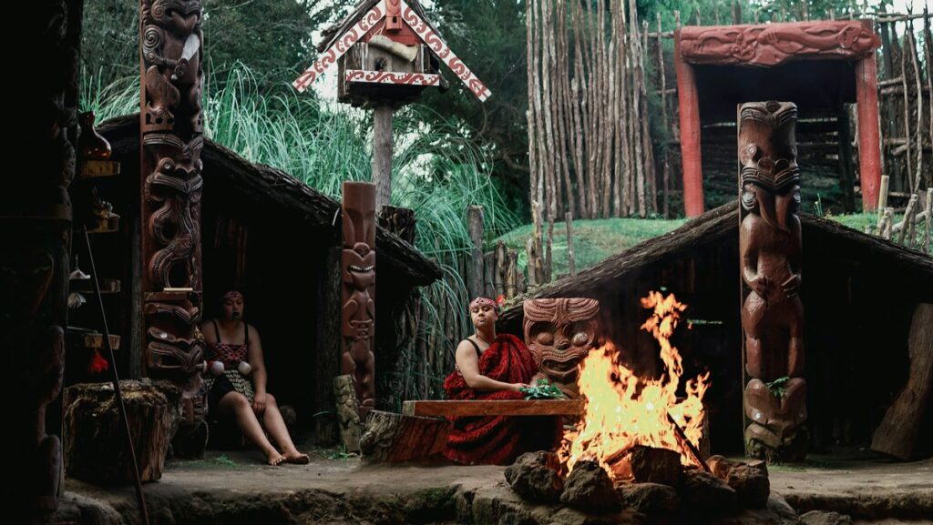 group of Māori people near a fire pit