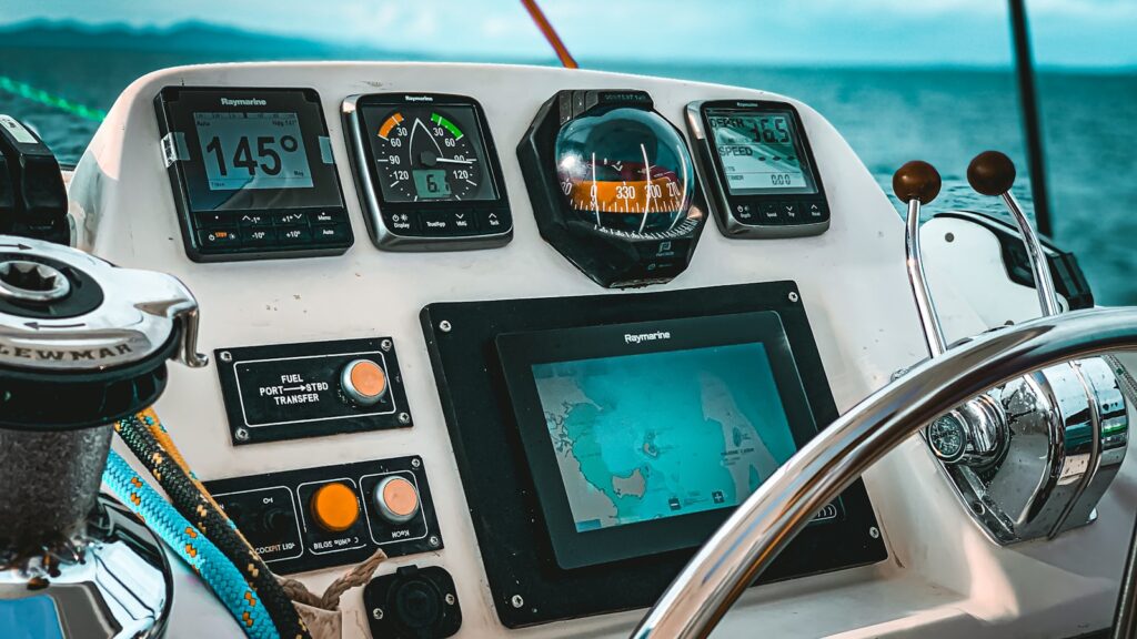 boat's navigation deck with radar and instruments