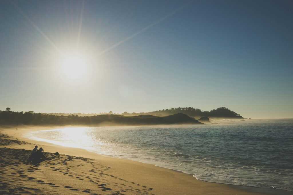 Bright sun shining over a sandy beach