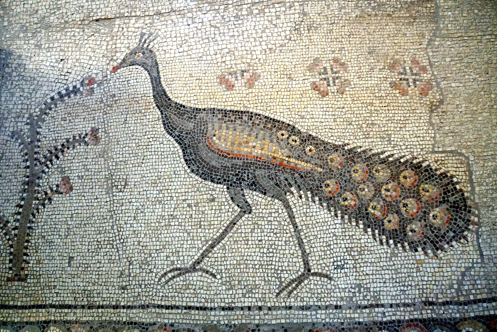 A peacock is depicted in a mosaic.