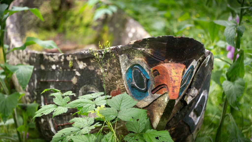 Canoe handcrafted by the Tlingit people, featuring a detailed bird totem design