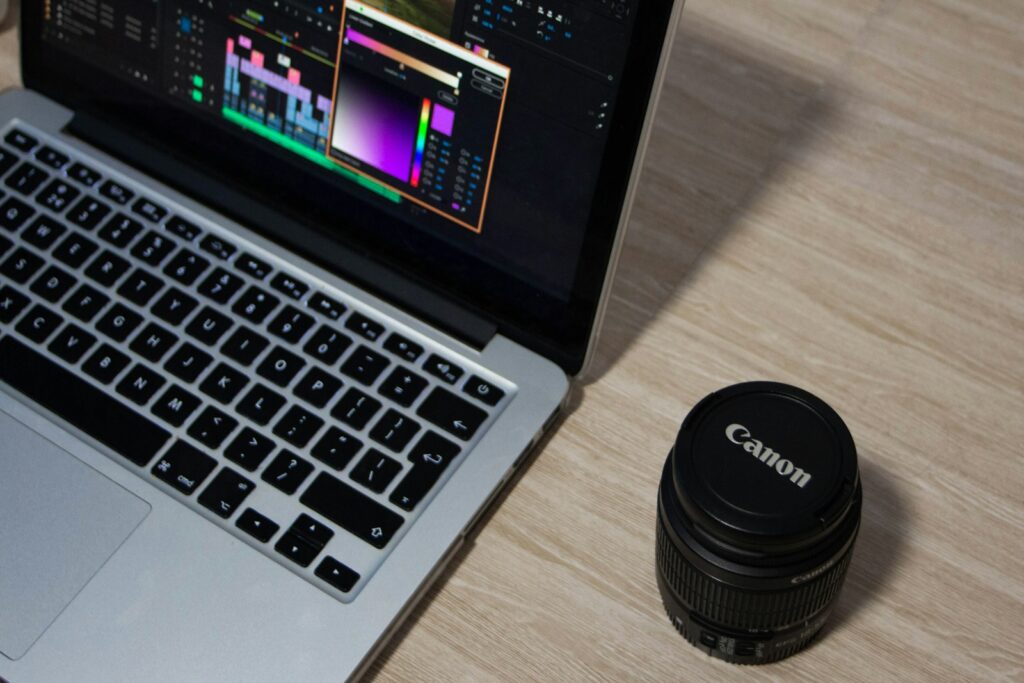 A Canon EF-S 18–55mm lens with its cap on.