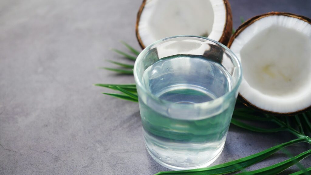 Clear glass filled with liquid coconut oil