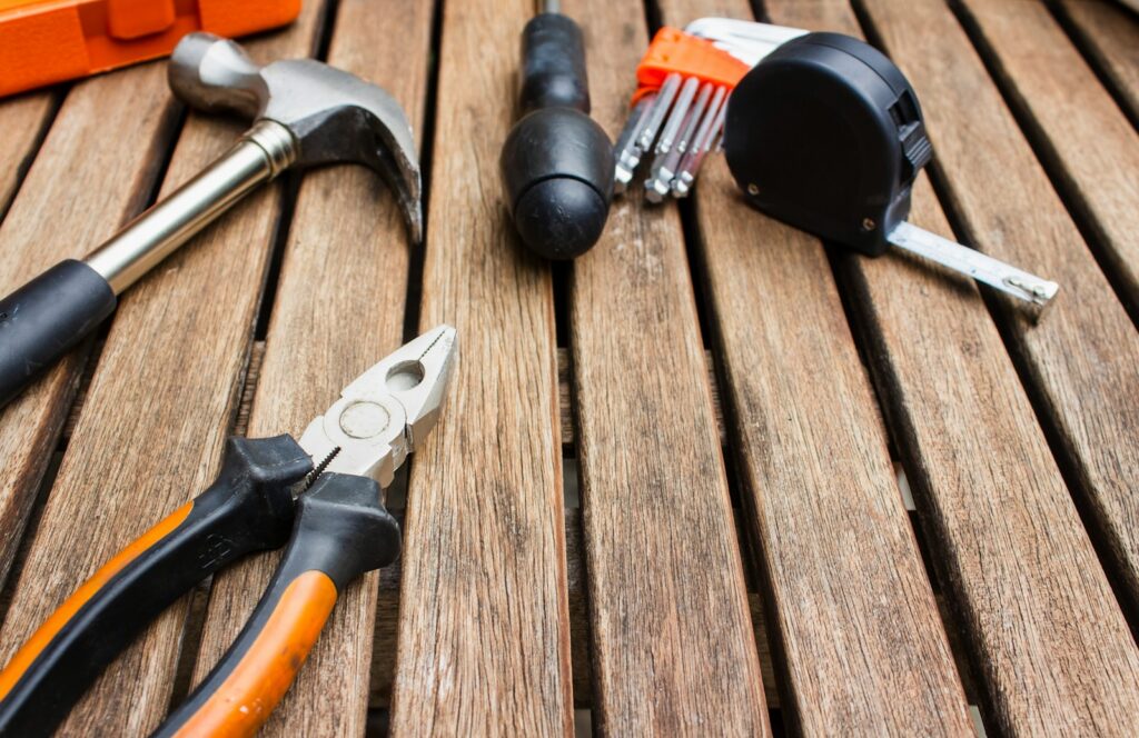 Carpentry tools on top a slatted wooden table
