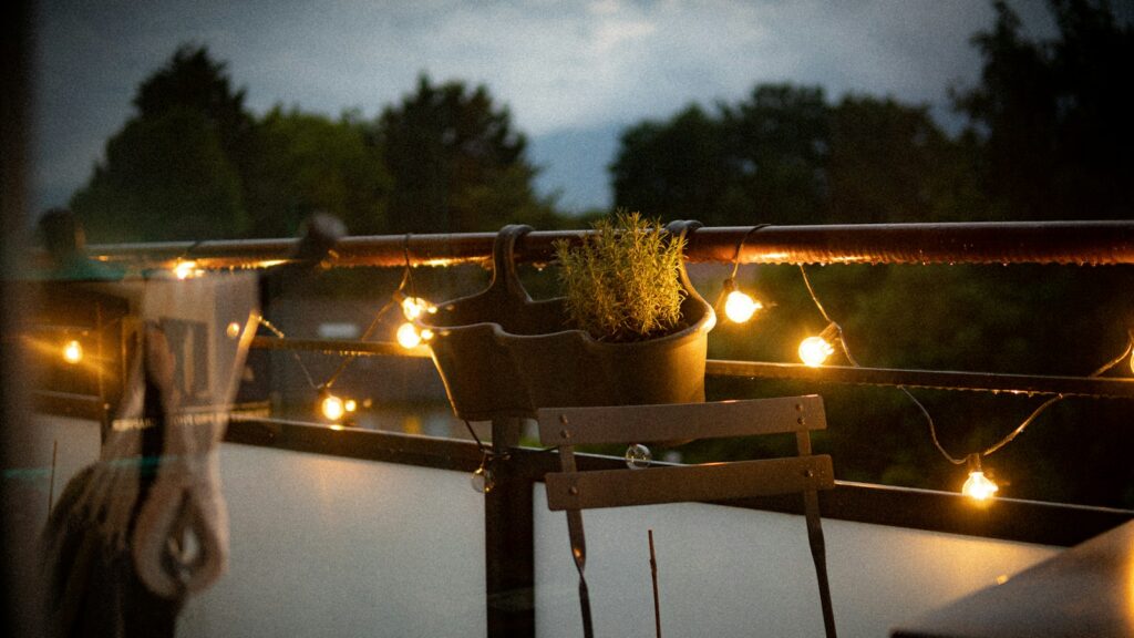Balcony railings decorated with string lights