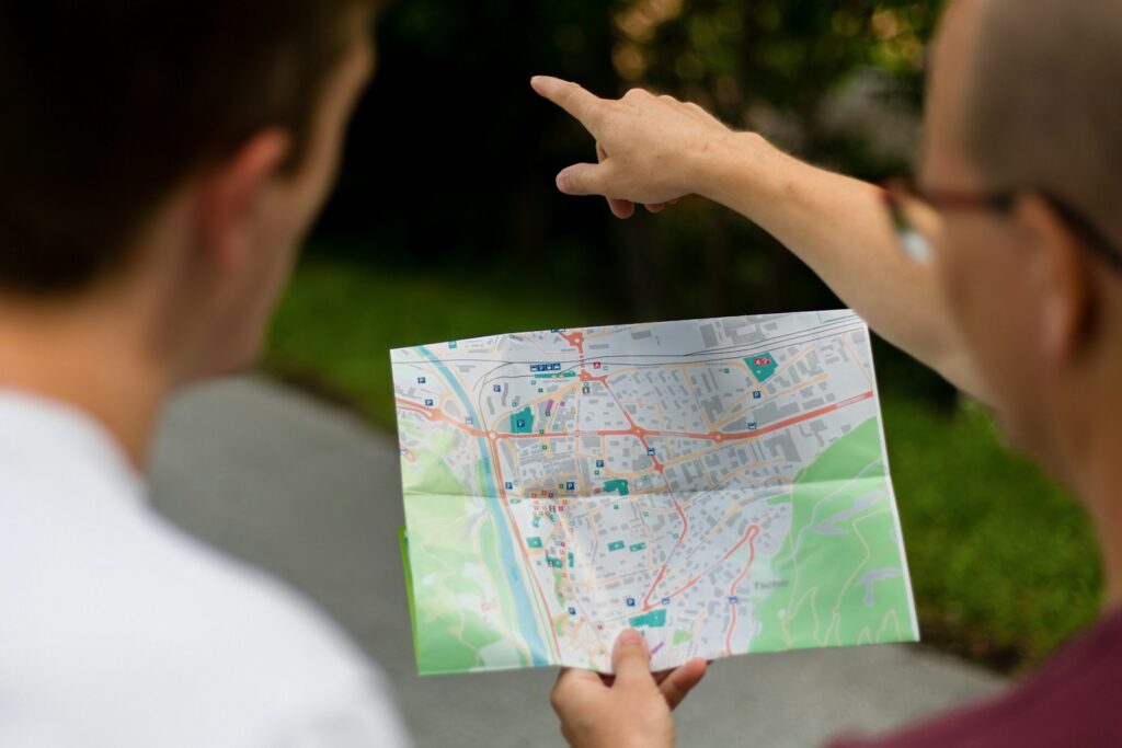 Two people are looking at a map.