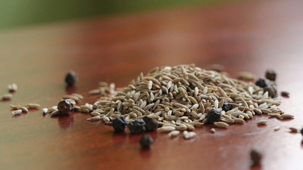 Close-up of mixed seeds on top of a wooden table