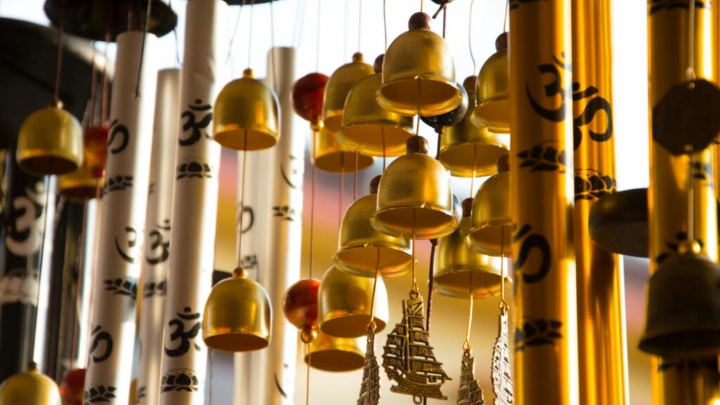 Elegant silver wind chimes paired with hanging gold bells