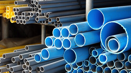 Stack of various sized PVC pipes