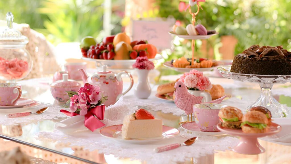 Elegant table setup with pink-themed decor and bird ornament