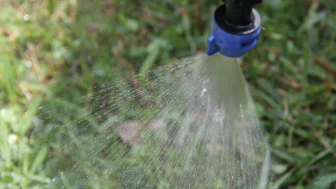 Pesticide application using a sprayer