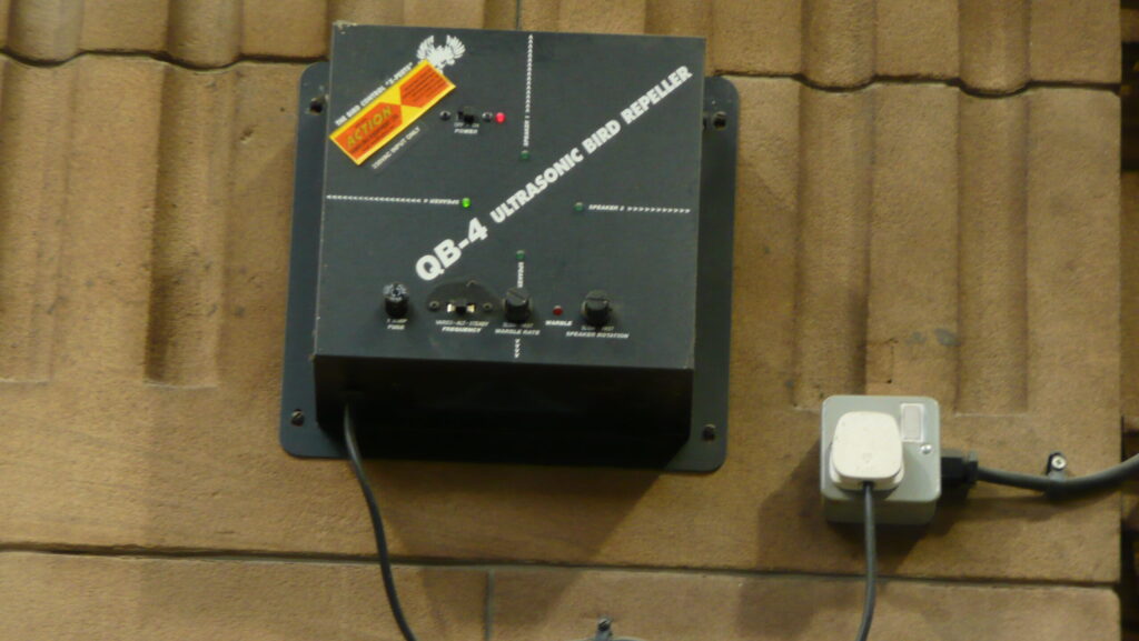 Bird repellent device mounted on exterior wall
