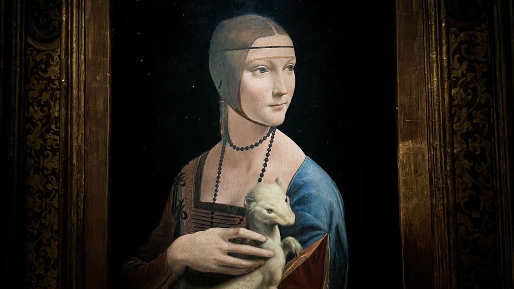 A classic painting, "Lady with an Ermine," depicts a woman holding a white stoat.