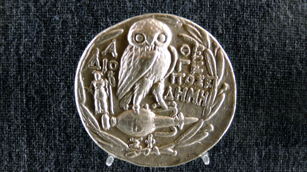 Ancient Greek silver coin with owl of Athena