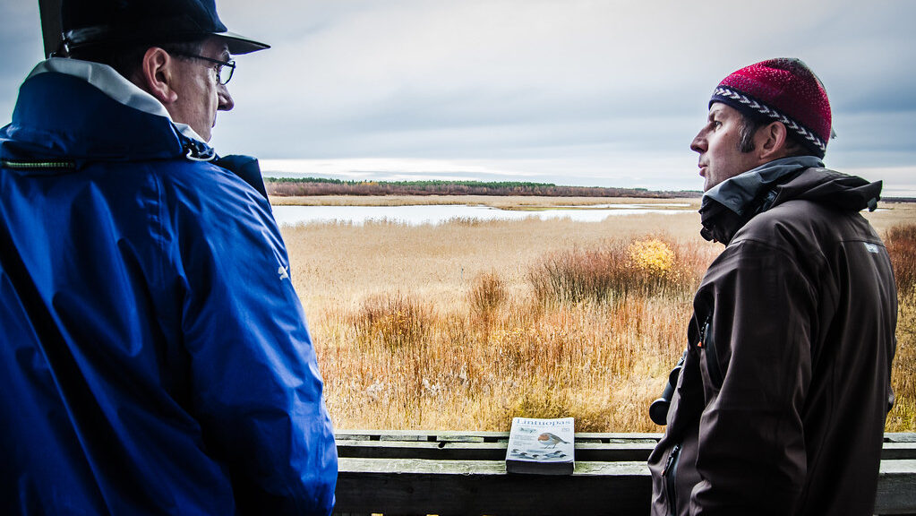 Two birdwatchers having a conversation