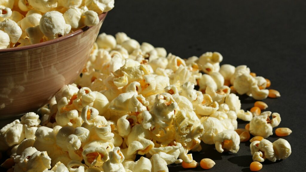 Fresh popcorn overflowing from bowl