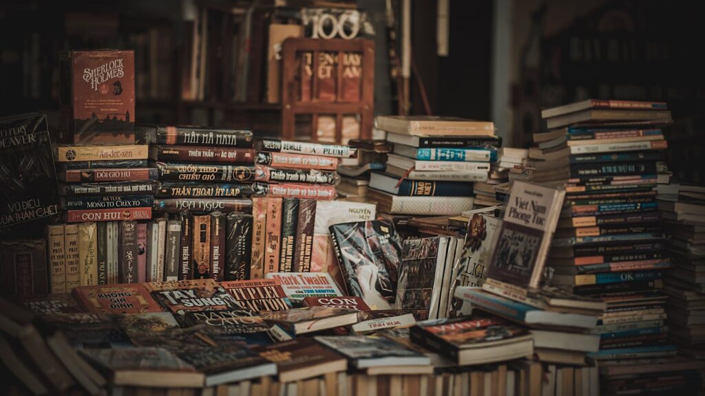 Assorted books arranged in a pile for display