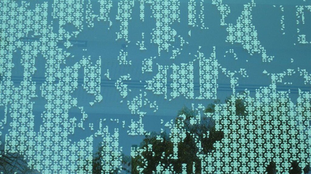 Close-up of glass surface featuring textured frit pattern