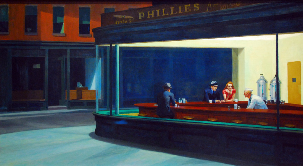A painting depicts three patrons and a server in a brightly lit diner at night, visible through large windows.