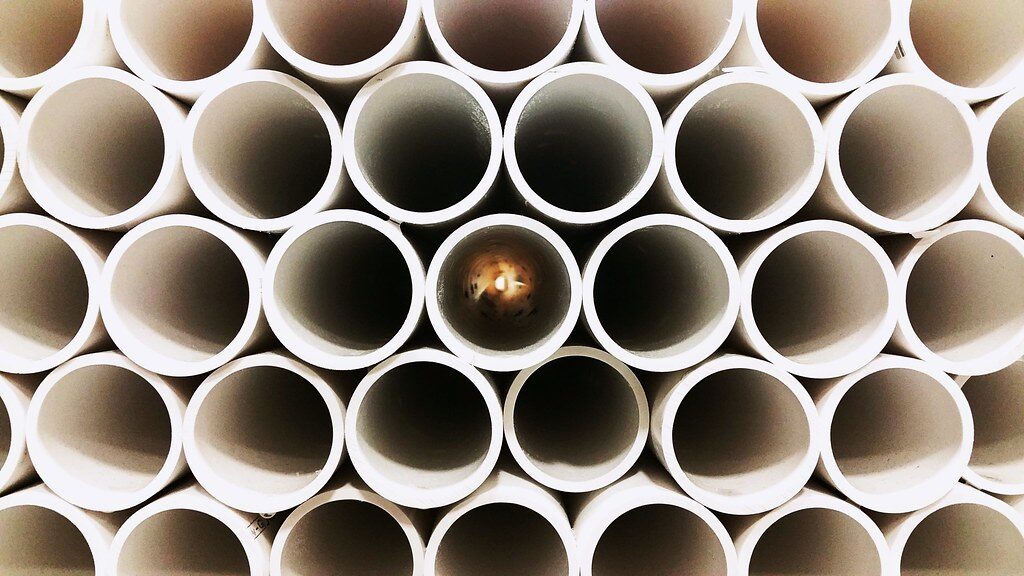 Stack of white PVC pipes