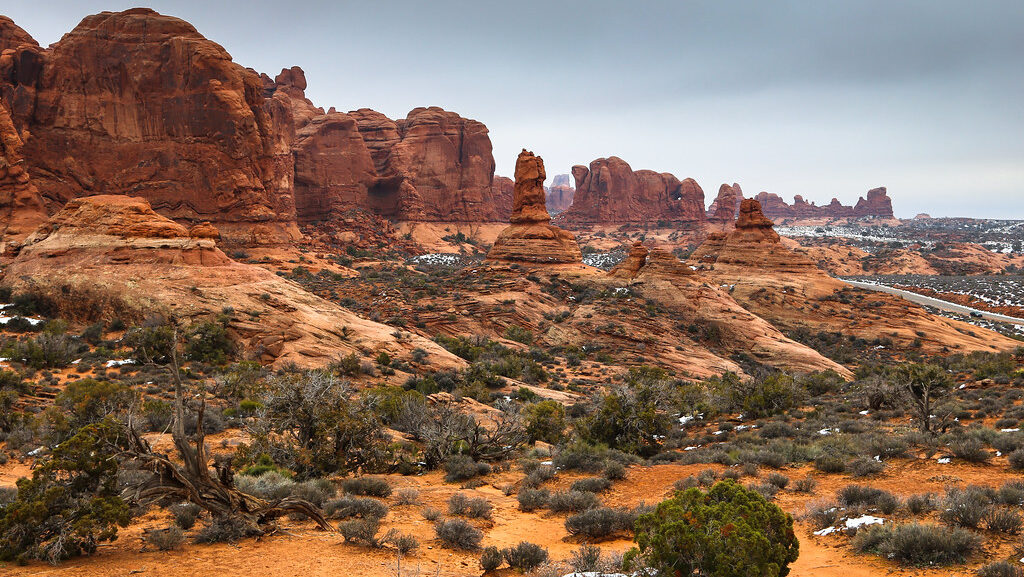Scenic desert landscape with iconic arches and rugged rock formations at Arches National Park