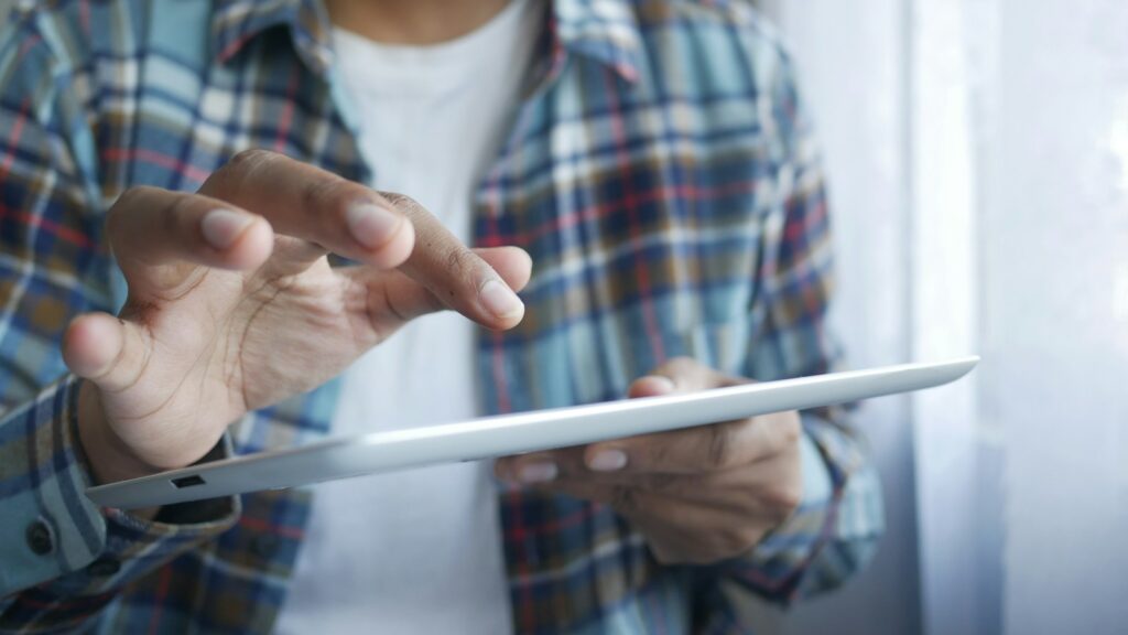 Man browsing information on a tablet