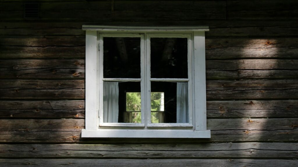 Exterior view of white wooden-framed glass window