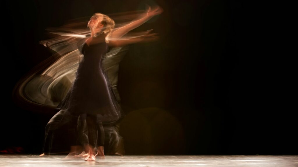 Woman performing contemporary dance on stage