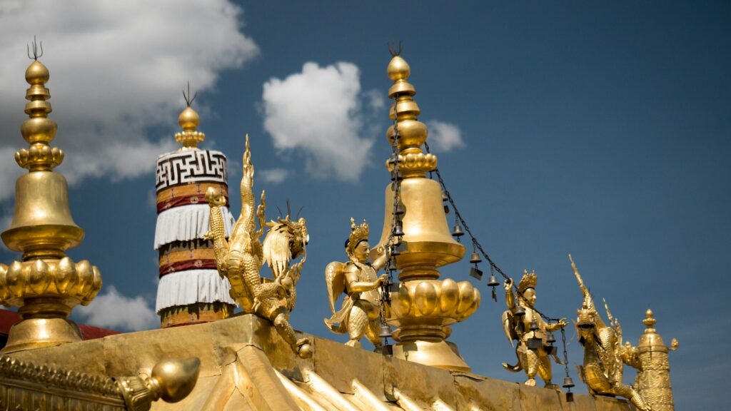 Ornate golden figures atop Jokhang Temple in Lhasa, Tibet