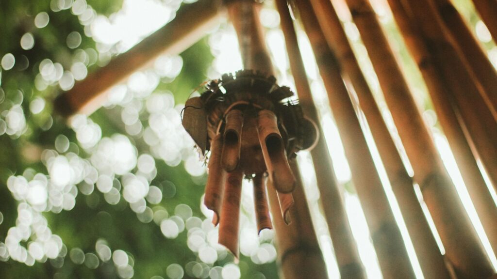 Hanging bamboo wind swaying in sunlight