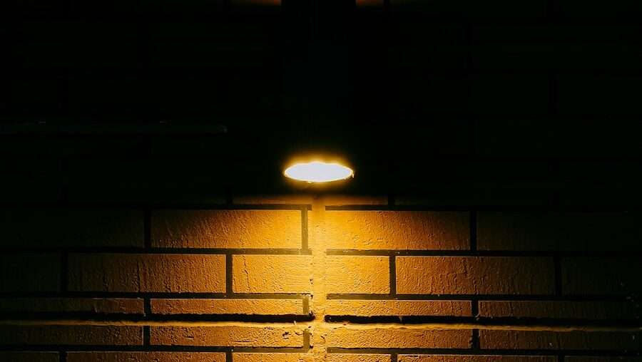 Soft yellow light illuminating dark wall