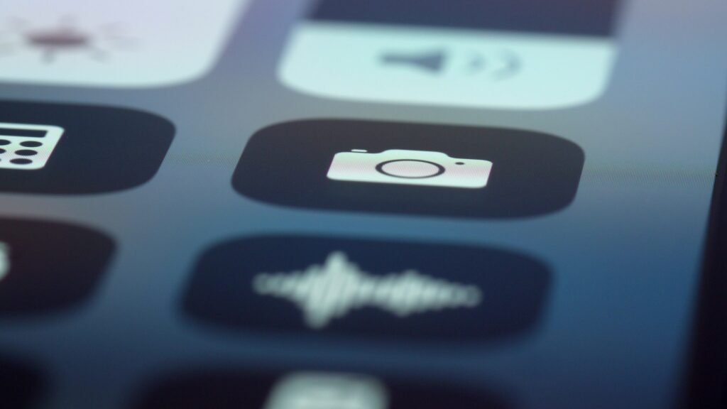 Smartphone screen displaying camera app shortcut button interface